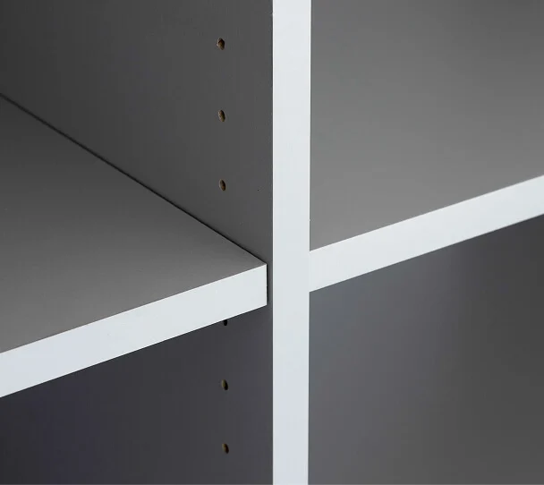 Cabinet interior with shelf adjustment positions