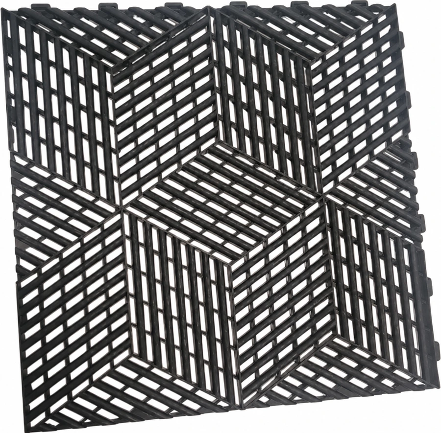 Charcoal modular tile sample showing its black label · cube pattern and edge connectors